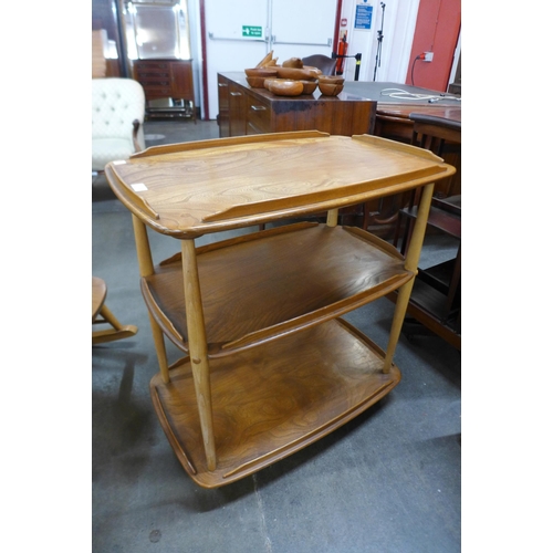 99 - An Ercol elm and beech Windsor trolley