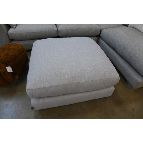 1301 - A designer grey upholstered corner sofa/chaise with contrasting footstool