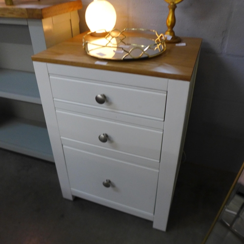 1419 - A cream painted and oak three drawer chest of drawers