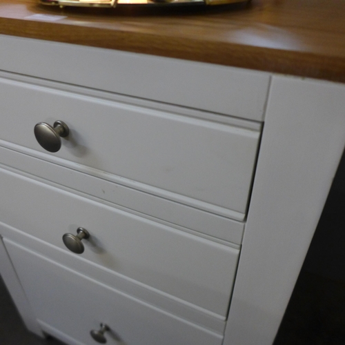 1419 - A cream painted and oak three drawer chest of drawers