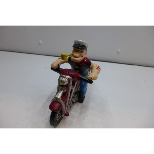 2101 - Cast Popeye figure on motorcycle * This lot is subject to VAT