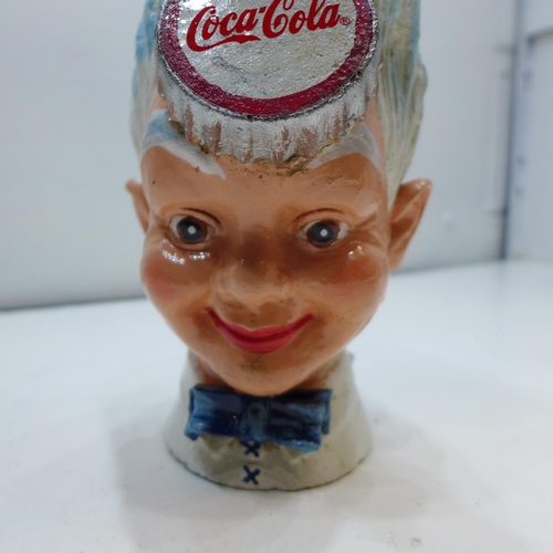 2110 - Cast metal Coca Cola bank * This lot is subject to VAT