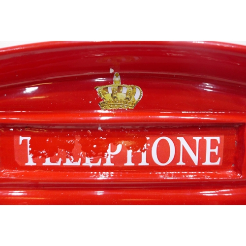 2118 - Telephone box coat rack * This lot is subject to VAT