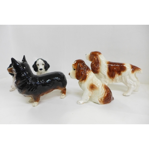 612 - Four Sylvac dogs and one Beswick Black Prince dog figure