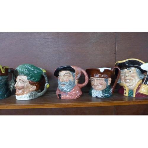 615A - A collection of eleven large Royal Doulton character jugs