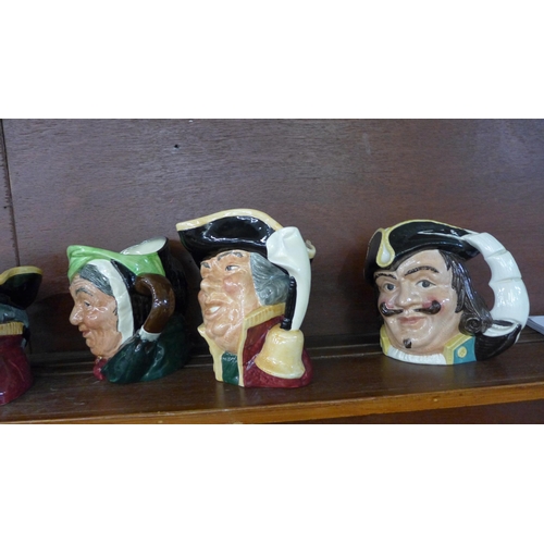 615A - A collection of eleven large Royal Doulton character jugs