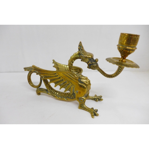 619 - A pair of brass dragon chamber sticks, length 21cm