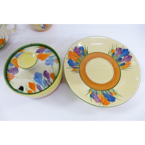 624 - A Clarice Cliff cup, a Crocus Bizarre bowl and saucer and an unmarked preserve pot