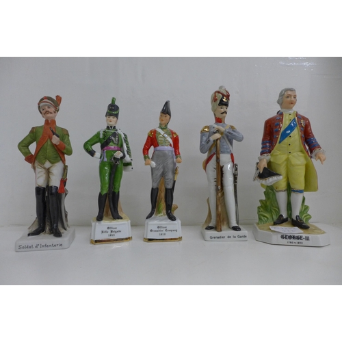 676 - A model of George III and four figures in military uniform