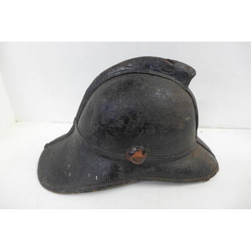 701d - A Victorian fireman's leather-shell helmet