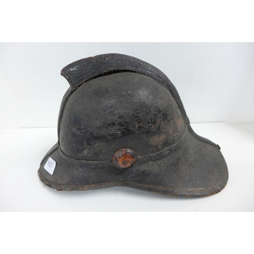 701d - A Victorian fireman's leather-shell helmet