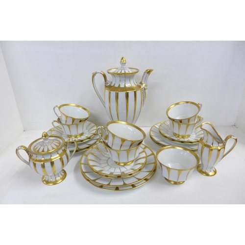 716 - A Forstenberg tea service, one cup a/f