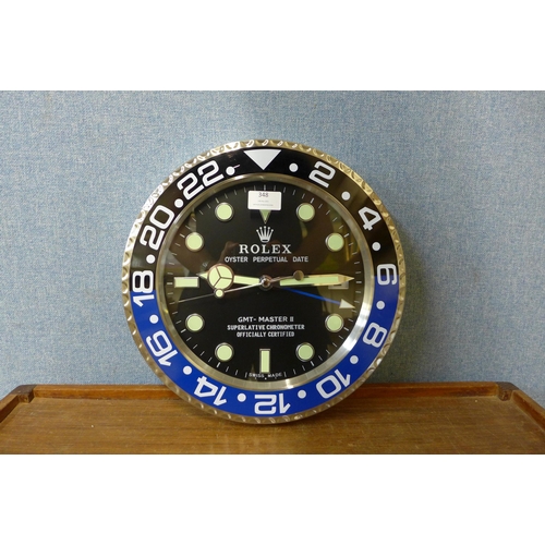 348 - A Rolex style dealer's circular wall clock