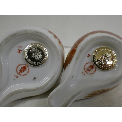 621 - Two Royal Crown Derby bird paperweights with silver and gold stoppers