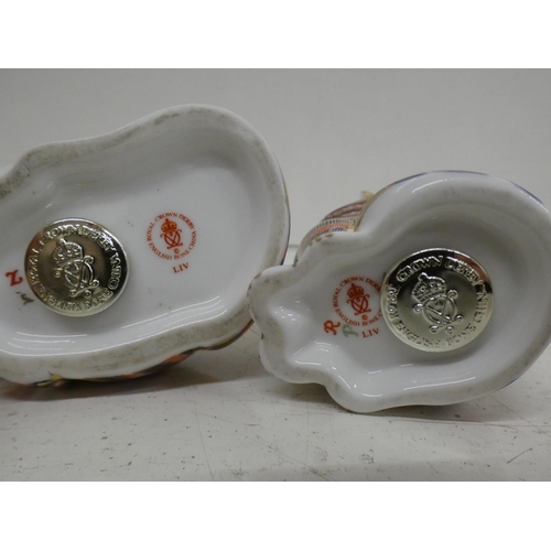 623 - Two Royal Crown Derby cat paperweights with silver stoppers