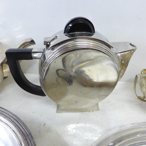 729 - A Cristofle Art Deco teapot, a three piece plated Art Deco tea service and a plated tureen