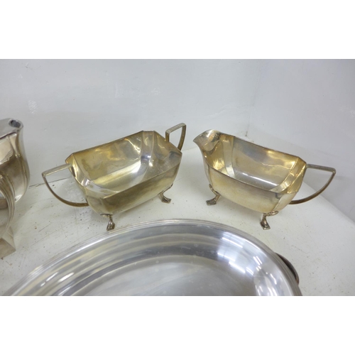 729 - A Cristofle Art Deco teapot, a three piece plated Art Deco tea service and a plated tureen