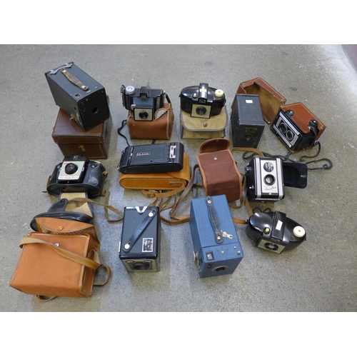 733 - A collection of old cameras, box brownie, folding, Kodak Duaflex II, doll, etc.