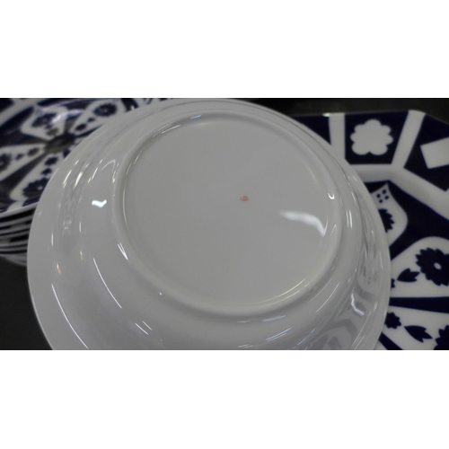 771 - A large collection of unfinished blue and white Royal Crown Derby including twenty plates, two large... 