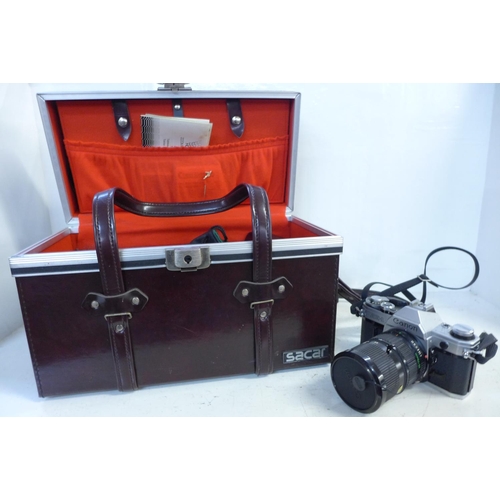 773 - A Canon AE-1 camera with box and accessories including lenses, filters, etc.