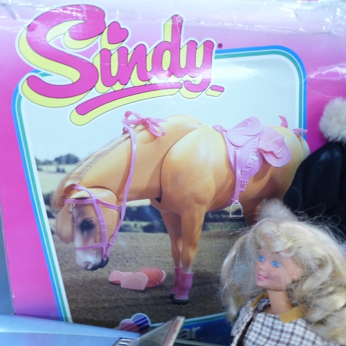 782 - Two boxes of Barbie and Sindy dolls, furniture, vehicles, etc., some boxed