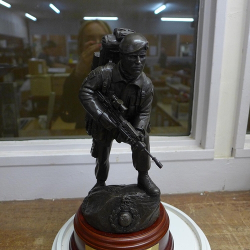 786 - A resin model of a Royal Marine on a wooden plinth with plaque under a glass dome, dome 36cm
