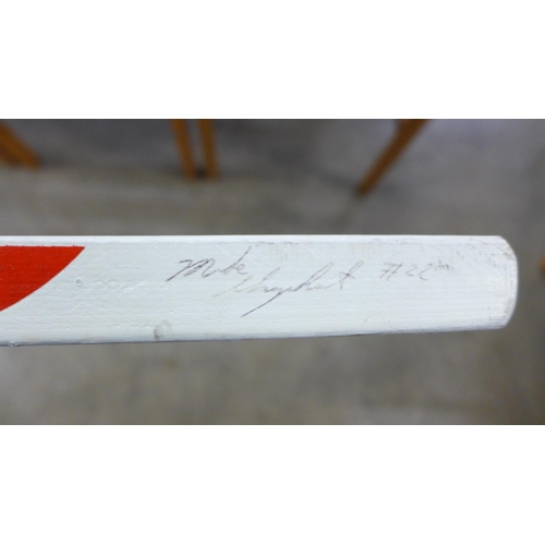 805 - A signed Koho ice hockey stick with two pucks
