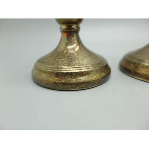 824 - A pair of dwarf candlesticks and a pair of Victorian silver vases