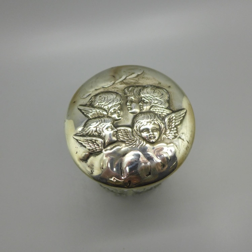 829 - A silver topped cut glass jar decorated with Reynolds angels, Birmingham 1904