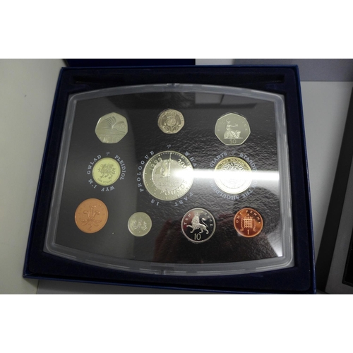 851 - A Royal Mint UK proof coin collection 2000 and a Westminster The Queen's New Portrait Specimen Set, ... 