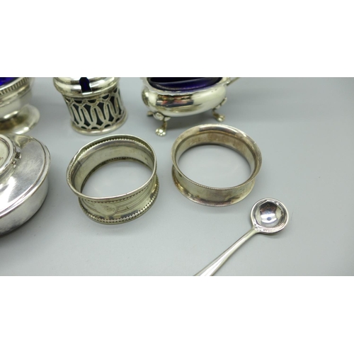 856 - Five silver thimbles including two Charles Horner, a silver salt and mustard, a silver burner, etc.,... 