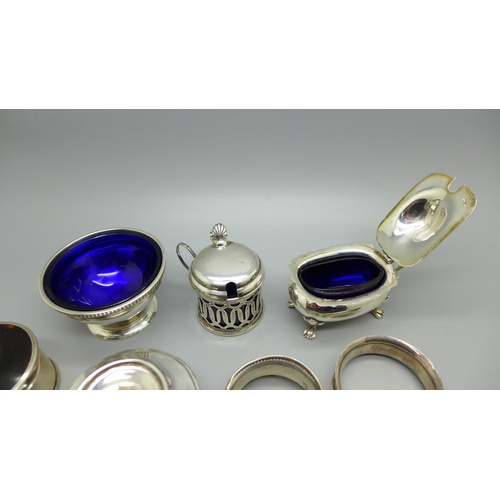 856 - Five silver thimbles including two Charles Horner, a silver salt and mustard, a silver burner, etc.,... 