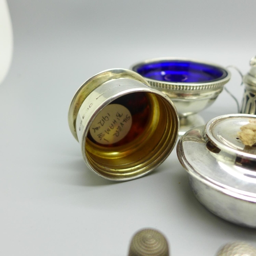 856 - Five silver thimbles including two Charles Horner, a silver salt and mustard, a silver burner, etc.,... 