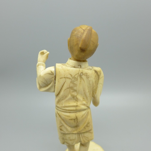 859 - A carved ivory figure with later applied head, a/f