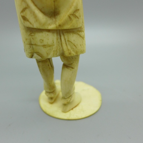 859 - A carved ivory figure with later applied head, a/f