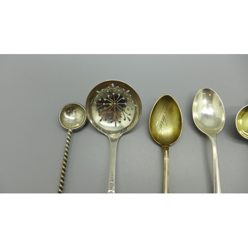 880 - A pair of Victorian silver mustard spoons, Newcastle 1855, Gowland Brothers, a silver sifter spoon, ... 