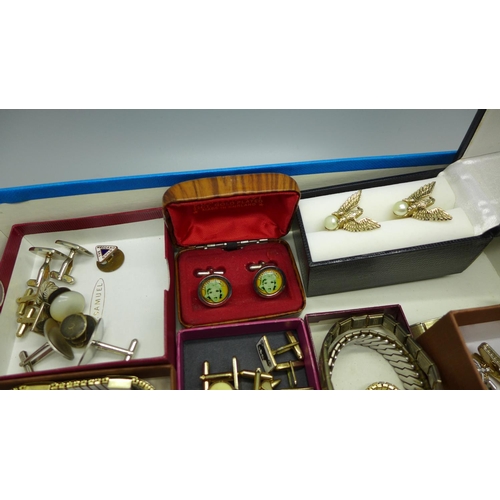 886 - A collection of cufflinks including American Swank eagle, a Paul Jobin wristwatch, shirt sleeve susp... 