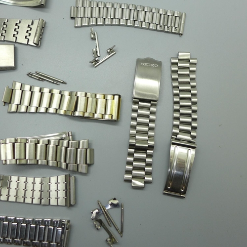 898 - Seven Seiko bracelets; five stainless steel, two gold plated plus one stainless steel Ricoh bracelet