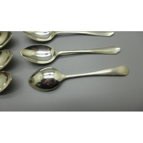 899 - A silver spoon, cased, a silver spoon and pusher and a set of six silver spoons, 120g