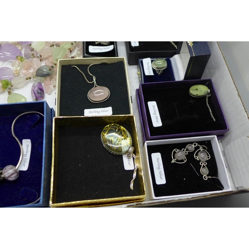 918 - A collection of gem set silver jewellery