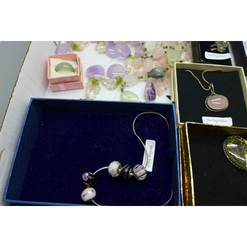 918 - A collection of gem set silver jewellery