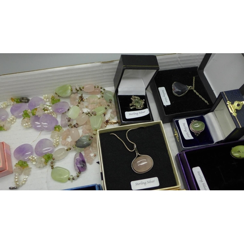 918 - A collection of gem set silver jewellery