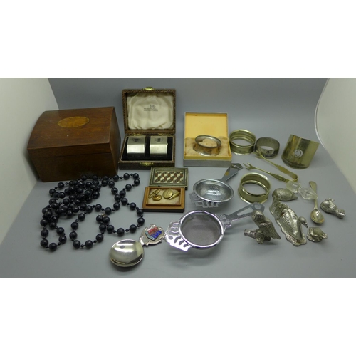 923 - A pair of Art Deco silver napkin rings by Walker & Hall, cased, one other silver napkin ring, etc.