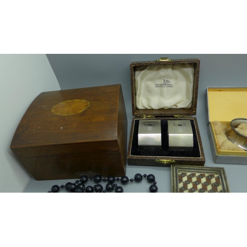 923 - A pair of Art Deco silver napkin rings by Walker & Hall, cased, one other silver napkin ring, etc.