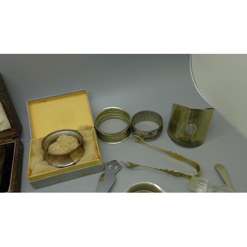 923 - A pair of Art Deco silver napkin rings by Walker & Hall, cased, one other silver napkin ring, etc.
