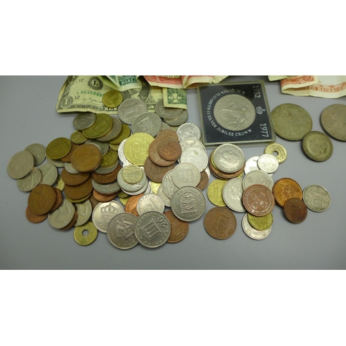 932 - A collection of coins and banknotes, including commemorative coins and a US $1 note