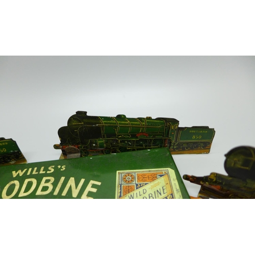 933 - A tin-plate Wills's Woodbine Cricket Game and four tin-plate locomotive plaques