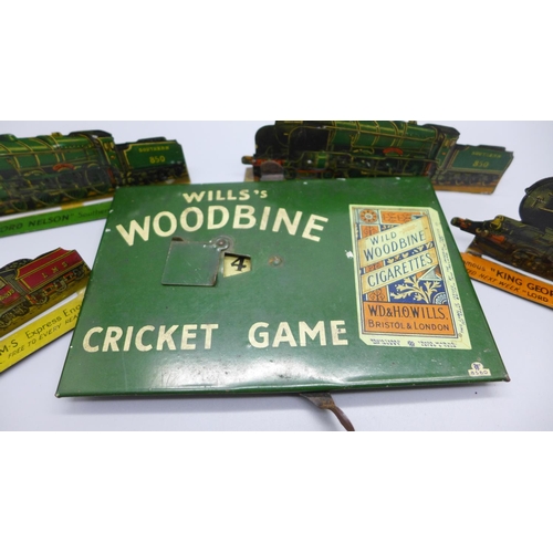 933 - A tin-plate Wills's Woodbine Cricket Game and four tin-plate locomotive plaques