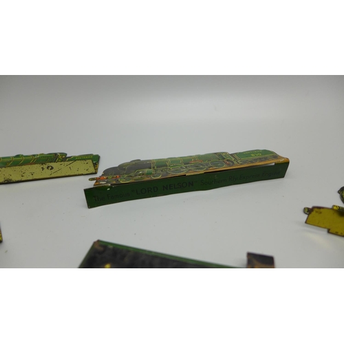 933 - A tin-plate Wills's Woodbine Cricket Game and four tin-plate locomotive plaques