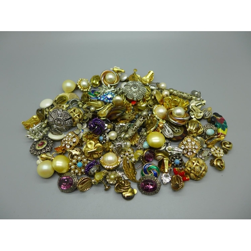 948 - Over sixty pairs of vintage clip-on and screw-on earrings